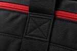 Close-up of heavy-duty woven polyester and red coil zipper on wholesale duffle bag