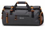 Custom waterproof duffle bag in black with orange trims, roll-top closure, front zip pockets and Wani Wear logo