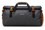 view of roll-top gym duffle bag showing ventilated mesh shoe compartment, air vents and Wani Wear woven label