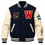 Custom letterman jacket in navy with cream sleeves, red chenille-style W chest letter, eagle patch, sleeve star and lightning patches, and snap front