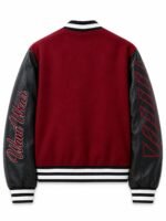 Back of burgundy wool and leather varsity jacket with embroidered script logo and geometric sleeve graphic