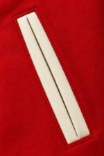 Cream-piped welt pocket on red private label basketball varsity jacket