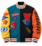 Custom colorblock varsity jacket with teal and black wool body, yellow and orange sleeves and chenille patches