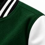Green wool body, white leather sleeve and black and white striped collar on letterman jacket