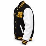 Custom black and white letterman jacket with gold script name embroidery and gold snap buttons