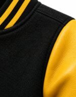 Black wool body, yellow leather sleeve and striped rib collar detail on baseball jacket