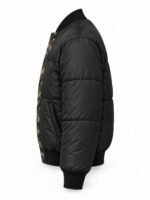 Side profile of custom quilted bomber jacket showing welt pocket and puffer sleeve