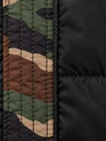 Close-up of black nylon twill shell and quilting stitch on puffer bomber jacket