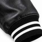 Leather sleeve with black and white striped rib-knit cuff on wholesale varsity jacket Product Tags custom varsity jacket, custom varsity jacket manufacturer, varsity jackets wholesale, custom letterman jacket, private label varsity jacket, OEM varsity jacket, ODM varsity jacket, wool and leather varsity jacket, black varsity jacket, chenille patch jacket, bulk varsity jackets, team varsity jackets, streetwear varsity jacket, baseball varsity jacket, low MOQ varsity jacket, varsity jacket supplier USA, varsity jacket supplier UK, varsity jacket manufacturer Pakistan, Sialkot jacket manufacturer, Wani Wear I inferred a few specs from the photos, including the wool-blend body, the satin lining and the leather options. Please adjust any of them that don't match your actual production before publishing.