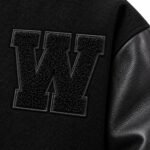 Black chenille W patch with embroidered outline on custom varsity jacket