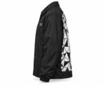 Side view of black custom printed coach jacket with geometric back print and chest logo