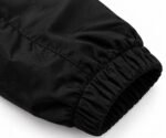 Close-up of elastic cuff on black nylon custom printed coach jacket