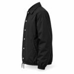 Side view of black custom windbreaker coach jacket with metal snaps and slanted welt pocket