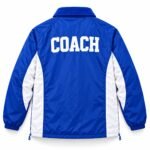 Custom team coach jacket back with white COACH varsity lettering and color-block panels