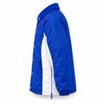 Side view of royal blue color-block coach jacket with white side panel and drawcord hem