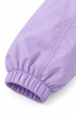 Custom cropped coach jacket balloon sleeve with elastic cuff in lavender nylon