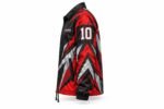 Side view of a red and black sublimated coach jacket with sleeve number 10