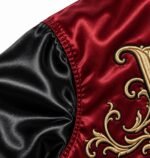 Close-up of gold 3D embroidery on custom satin coach jacket back panel