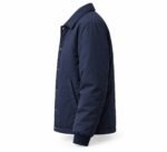 Side view of navy insulated coach jacket with brass snap buttons, welt pocket and rib-knit cuffs