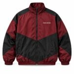 Front view of custom vintage windbreaker with full zip, stand collar, chevron panels, and Wani Wears chest logo