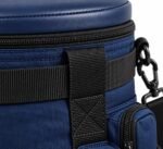 Close-up of padded faux-leather seat lid, wraparound zipper, reinforced webbing handle and metal swivel snap hook on softball ball bag
