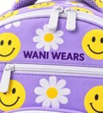 Close-up of Wani Wears embroidered logo on custom softball bat bag with white zippers and sublimated daisy print