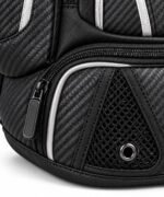 Close-up of carbon weave material, mesh vent and metal air eyelet on custom bat bag cleat compartment