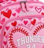 Close-up of 3D raised embroidery and baseball stitch heart design on Wani Wear private label bat bag