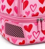 Close-up of ventilated cleat compartment and heart rubber zipper pulls on custom softball bat bag Close view (embroidery): Close-up of 3D raised embroidery and