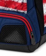 Close-up of ventilated mesh cleat compartment, red zipper and reinforced black base on flag bat bag